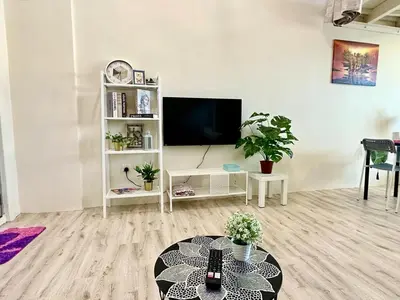a living room with a tv and a table at CEO9 Duplex Premier 6 Pax Suite#Disneys HS #PISA #USM #Pantai Hospital in Bayan Lepas