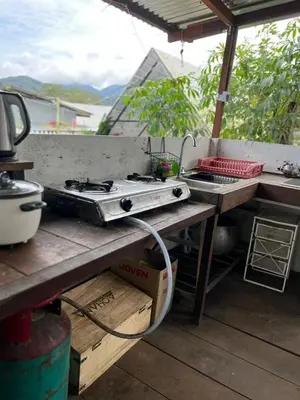 a stove top oven sitting on top of a table at The Backyard Glamping Cameron Highlands in Tanah Rata