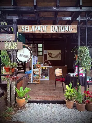 a sign for a stall at a plant dealer at The Backyard Glamping Cameron Highlands in Tanah Rata