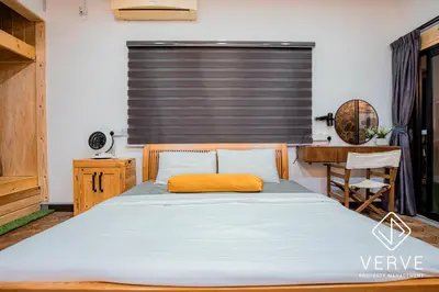 a bedroom with a bed and a desk and a sink at Ipoh 188 Private Pool Mansion by Verve 30 pax EECH119 in Ipoh