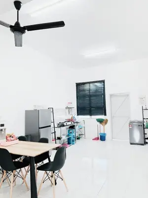 an empty room with a table and chairs at D' Splash Garden Homestay in Baling