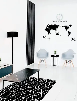 a room with two chairs and a table and a world map at D' Splash Garden Homestay in Baling