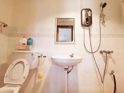 a bathroom with a toilet and a sink at 311 Pangkor Coral Bay Homestay in Pasir Bogak