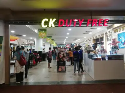 a store with people standing inside of a shopping mall at 311 Pangkor Coral Bay Homestay in Pasir Bogak