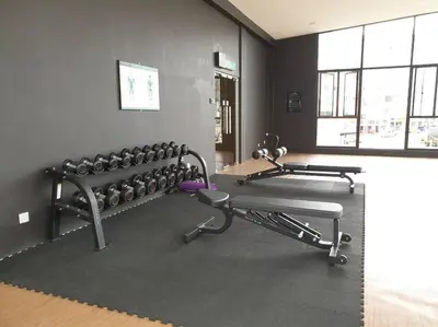 a gym with two rows of exercise bikes in a room at ForestNest Cameron Town Spacious 3R3B (1300 sqft) in Tanah Rata