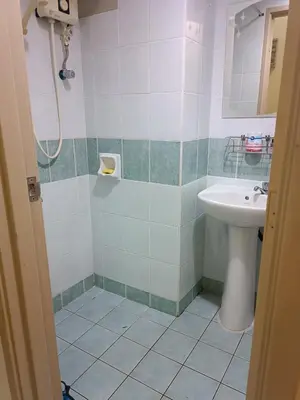 a bathroom with a sink and a shower at Sofea Inn Bukit Merah - Laketown A6172 in Kampong Selemat
