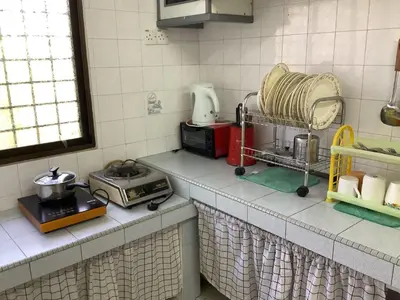 a kitchen with a counter top with some appliances at 4 Bedrooms Ipoh Landed House, Ipoh Town in Ipoh