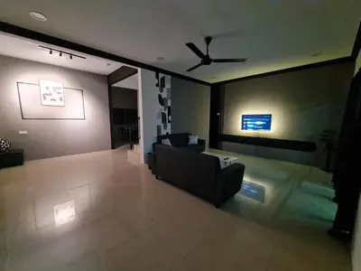 a living room with a couch and a ceiling fan at Air-home M1 Simpang near Aulong Econsave, 4BR, 10pax, Netflix in Simpang