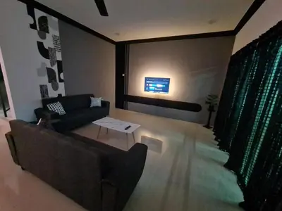 a living room with a couch and a table at Air-home M1 Simpang near Aulong Econsave, 4BR, 10pax, Netflix in Simpang