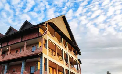 a building against a cloudy sky at Tekoma Hotel & Hostel Cameron Highlands - FREE SHUTTLE SERVICE in Tanah Rata