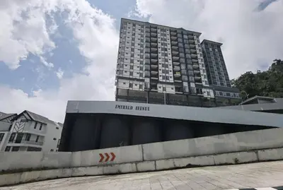 a tall building with a sign in front of it at Emerald Avenue Cozy 3R3B Apartment 822 in Brinchang