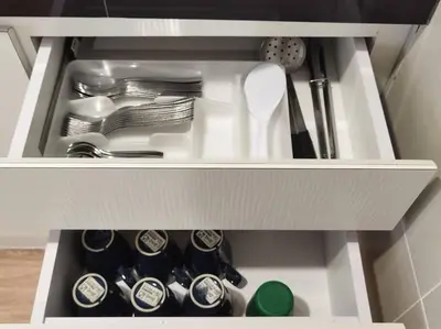 a white drawer filled with dishes and utensils at Emerald Avenue Cozy 3R3B Apartment 822 in Brinchang