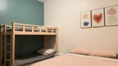 a bedroom with two bunk beds in a room at G Residence - Cosy 4R3B Semi-D in Brinchang Town in Brinchang