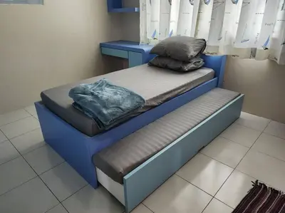 a bed in a room with two pillows on it at Gated Family House- next to MRSM in Kampong Kawak