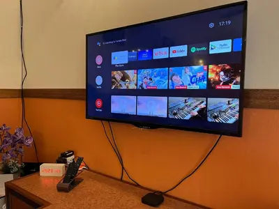 a flat screen tv hanging on a wall at Rumah Tamu by Perdana Hōmes for Múslim only in Sungai Petani