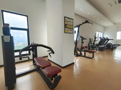 a gym with treadmills and exercise bikes in a room at \u3010NEW\u3011Modern Comfort Studio@Juru Sentral Icon City in Bukit Mertajam