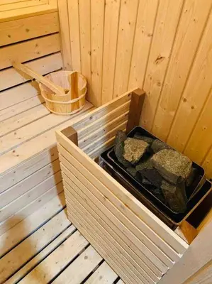 a inside of a sauna with some rocks in it at Abbie's Private Pool Villa Bukit Mertajam Penang in Bukit Mertajam
