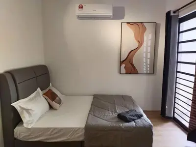 a bedroom with a bed and a painting on the wall at Bole Villa-Private Pool-BBQ-Karaoke 20pax in Ipoh