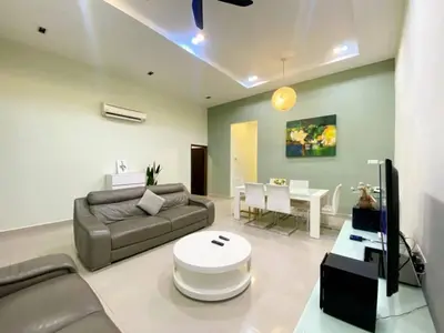 a living room with a couch and a table at Modern COZY SINGLE STOREY HOUSE ```` ALMA JUSCO BM in Bukit Mertajam