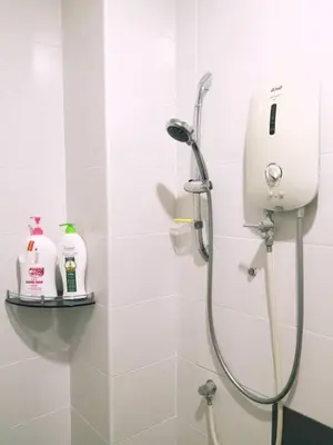 a shower in a white bathroom with a shower at Modern COZY SINGLE STOREY HOUSE ```` ALMA JUSCO BM in Bukit Mertajam