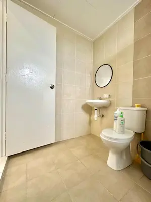 a bathroom with a toilet and a sink at Casa Ipoh Homestay by Comfort Home in Chemor