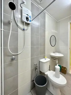 a bathroom with a shower and a toilet and a sink at Casa Ipoh Homestay by Comfort Home in Chemor