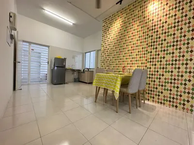 a kitchen with a table and chairs in a room at Casa Ipoh Homestay by Comfort Home in Chemor