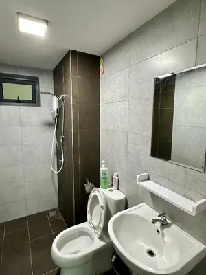 a bathroom with a white toilet and a sink at Spacious 3BR I Meritus Perai l Family & Nice View in Perai