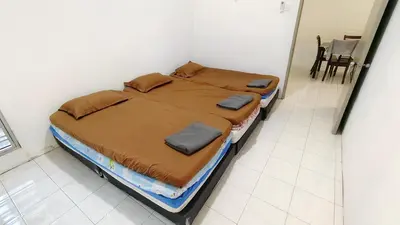 a bedroom with a bed in a room at 3 Rooms Apartment - Near Beach in Kampong Sungai Udang