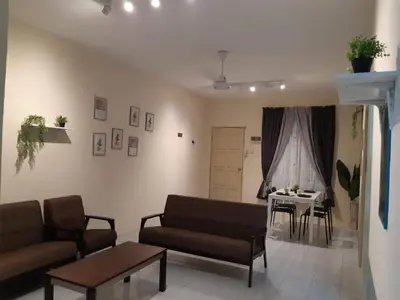a living room with a couch and a table at Ammar Homestay Gua Musang in Gua Musang