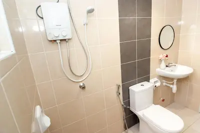 a bathroom with a shower and a toilet and a sink at Ipoh Town P Kepayang in Ipoh