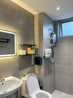 a bathroom with a toilet and a sink at JOVIAL Modern Cozy Suite `Metropol BM BandarPerda in Bukit Mertajam