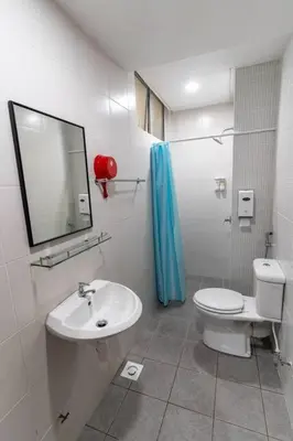 a bathroom with a toilet and a sink at Highland Green at Quintet (3BR/ 8pax) in Tanah Rata