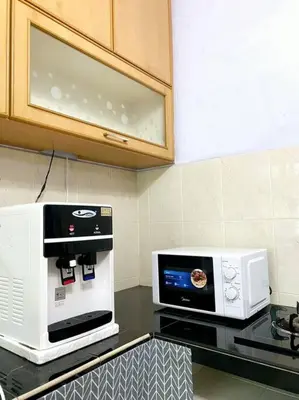 a microwave sitting on top of a counter in a kitchen at (TN)Modern Stylish 2 Storey Corner House @Alma BM in Bukit Mertajam