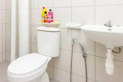a bathroom with a toilet and a sink at Suites Bayan Lepas in Bayan Lepas