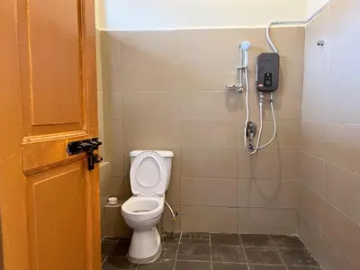 a bathroom with a toilet and a shower at Aayu Stewart - Stewart Ln, George Town in George Town