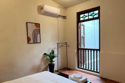 a bedroom with a bed and a window at Aayu Stewart - Stewart Ln, George Town in George Town