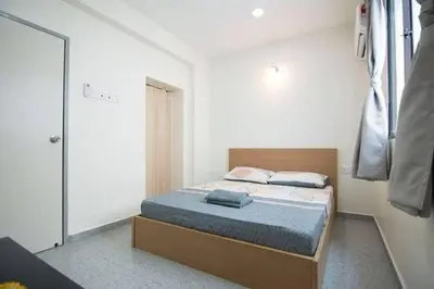 a bedroom with a bed with a blue mattress at Peace Casa - Homely & Cosy in Butterworth