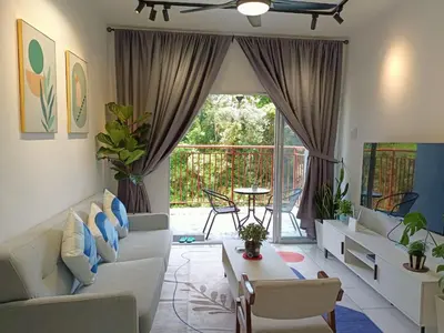 a living room with a couch and a table at Dream4 @ emerald avenue in Brinchang