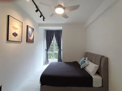a bedroom with a bed and a ceiling fan at Dream4 @ emerald avenue in Brinchang