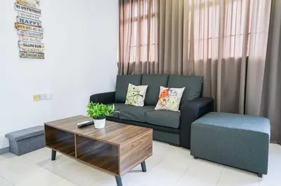 a living room with a couch and a coffee table at Jovial Modern Stylish Townhouse 8pax - BM Icon City in Bukit Mertajam