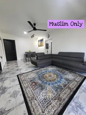 a living room with a couch and a rug at Homestay Kasih Tok Ayah Sg Petani in Sungai Petani
