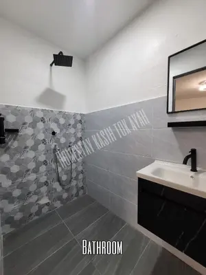 a bathroom with a shower and a sink at Homestay Kasih Tok Ayah Sg Petani in Sungai Petani