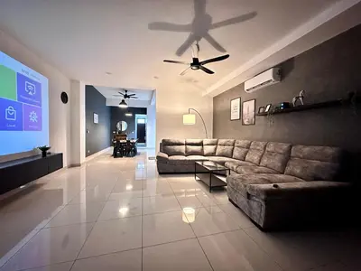 a living room with a couch and a ceiling fan at Queen’s Villa for 28Pax @Central of Penang in Jelutong