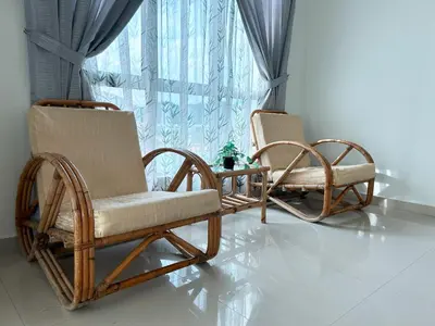 two wicker chairs sitting in front of a window at D'Sea Marina Island Resort by Manhattan Group in Lumut