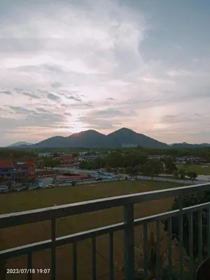 a view of a city with mountains in the background at Homestay Triple Q Manjung in Seri Manjung