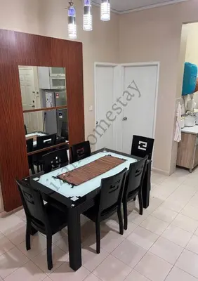 a dining room table and chairs in a kitchen at Anoi Homestay TAMBUN @ Lost World HighSpeed WiFi in Tambun