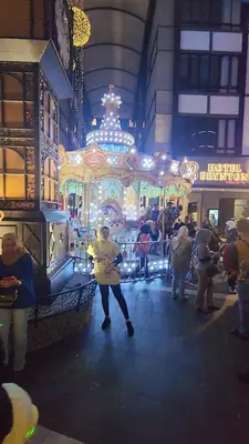 a group of people standing around a carousel in a building at Brinchang Cameron Highlands Homstay in Brinchang