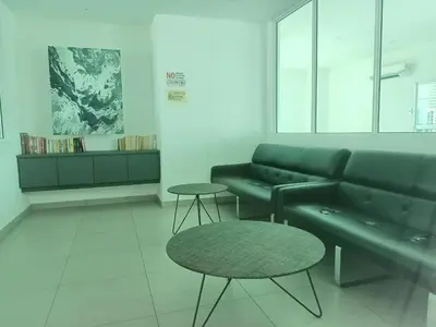 a living room with a couch and a table at Deluxe Suites 4, 2-5 pax, Netflix, Georgetown in Jelutong