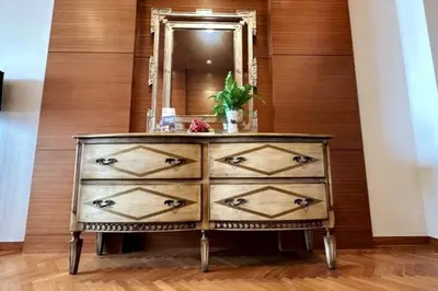 a dresser in a room with a mirror at Straits Quay Highest & Spacious Seaview Suite - 2 in Tanjong Tokong